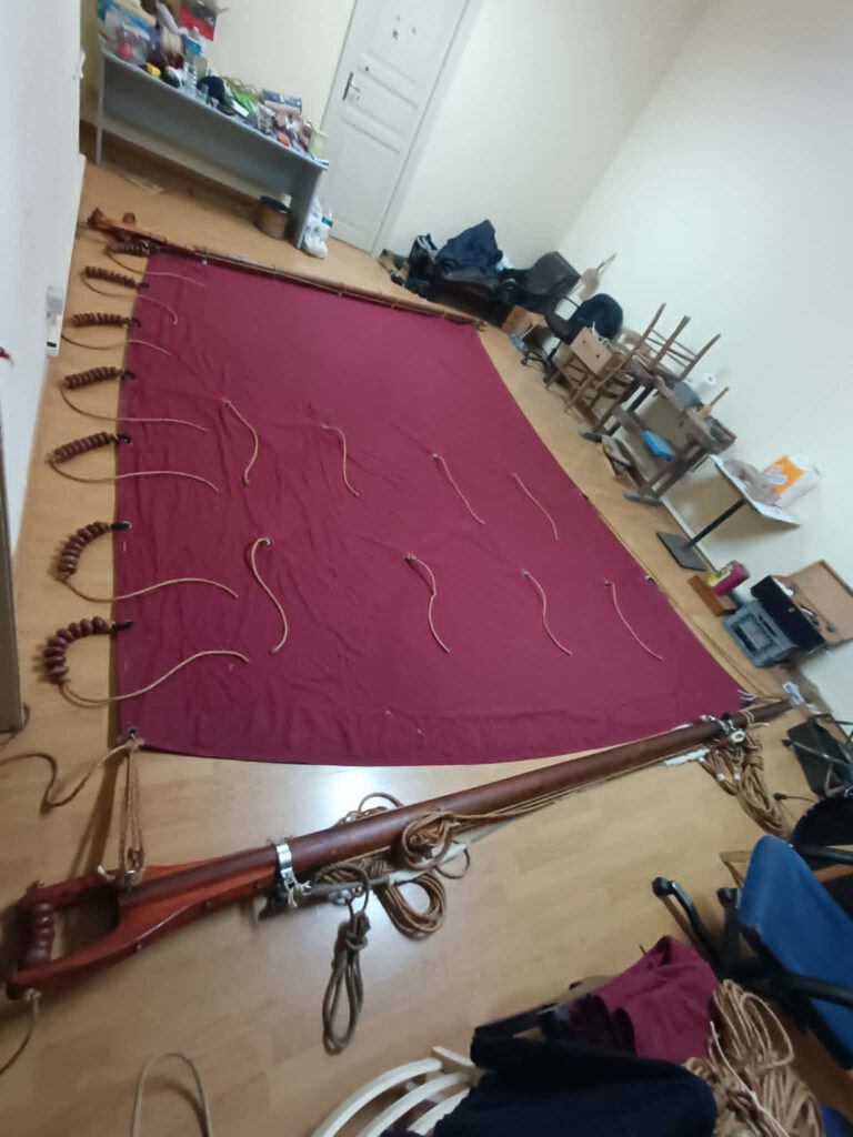 Cutting and hand-finishing a sail panel — entry-level Sail Making course at Seamanship Academy